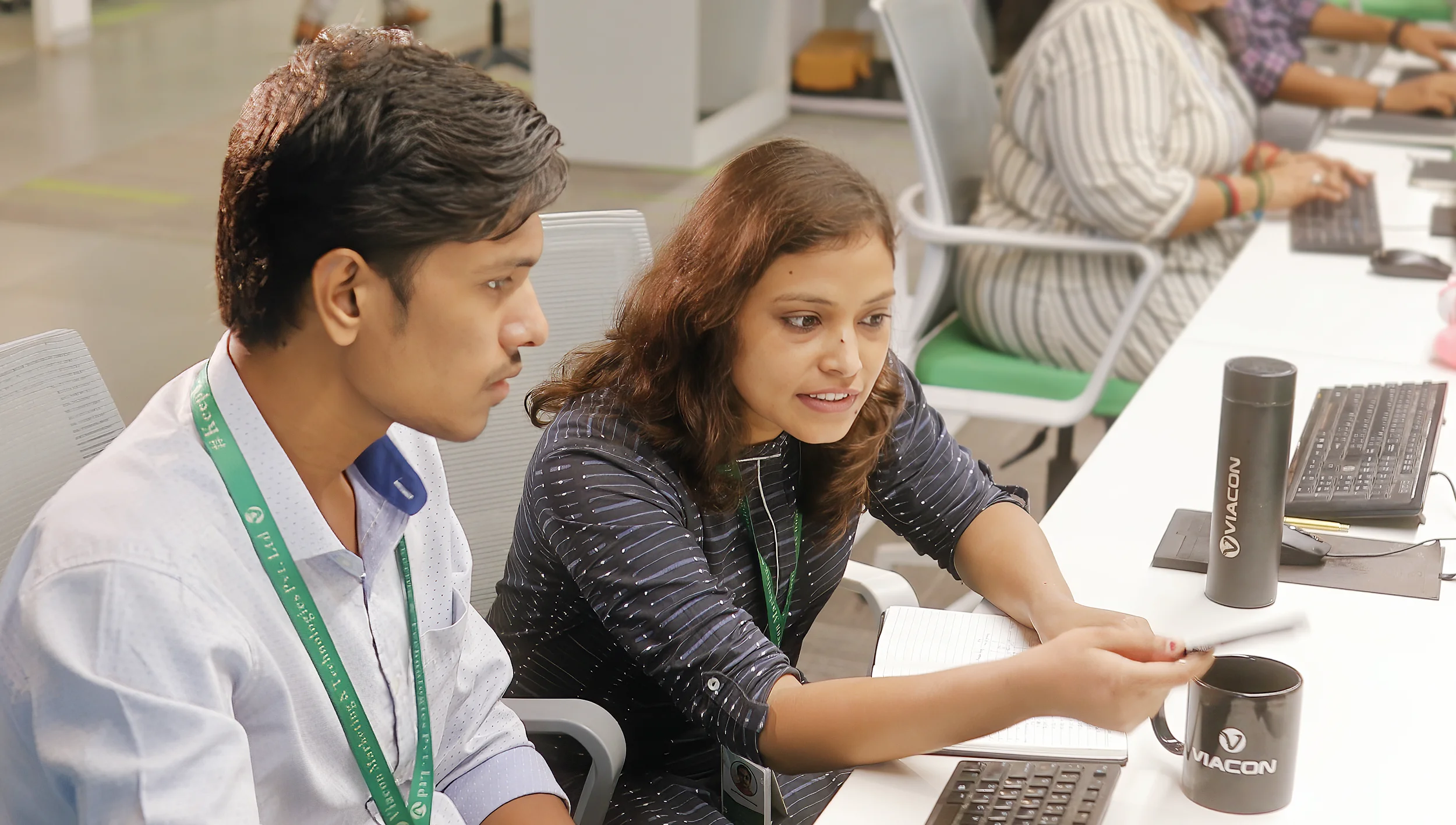 Two Viacon employees discussing a project